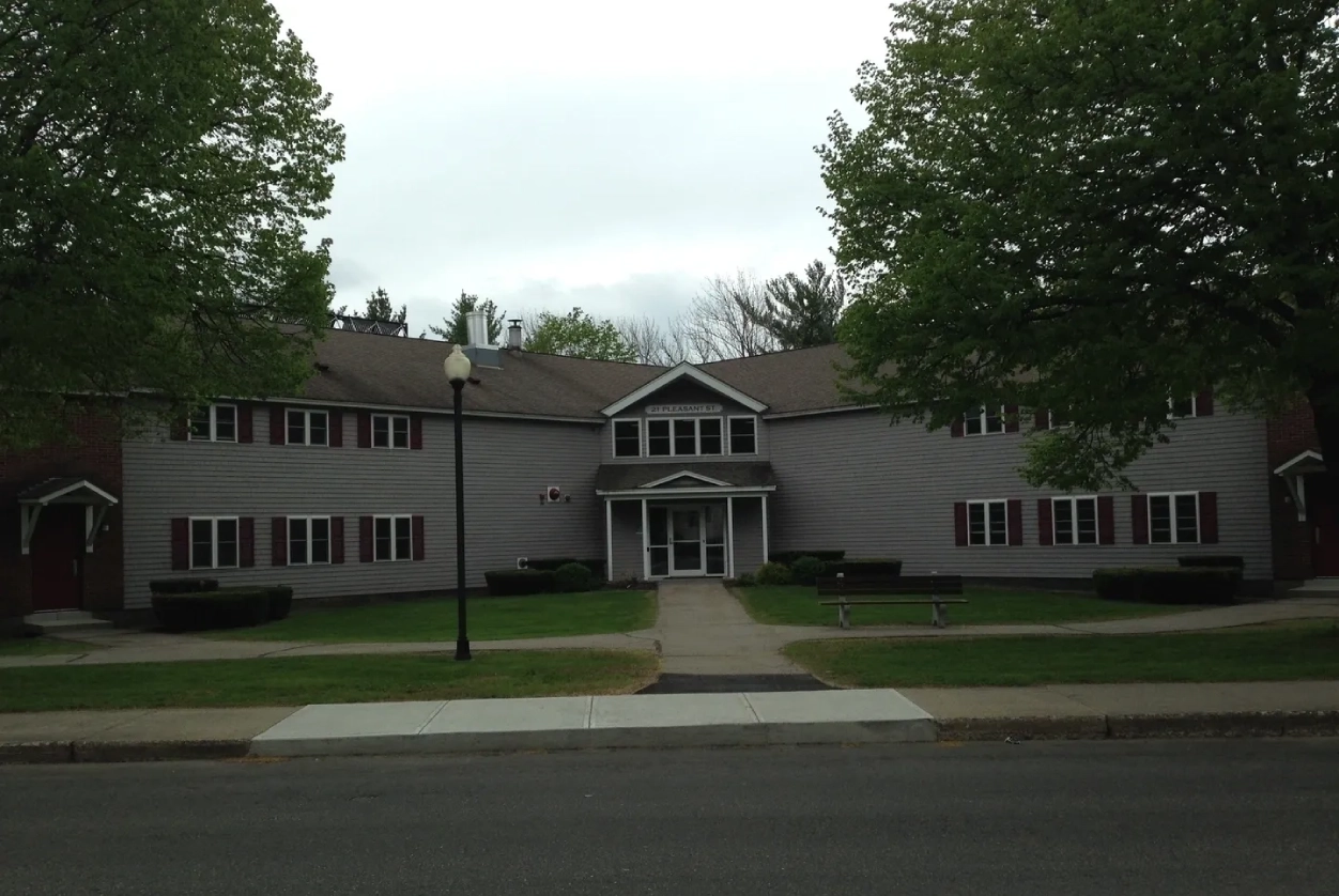 A large building with many windows on the front.